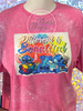 Heather Heliconia bleach patterned tee with Different is Beautiful with Stitch in different poses on it.
