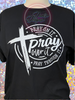 Black tee with Pray On It Pray Over It Pray Through It in white glitter vinyl.