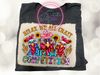 Dark Heather bleach patterned tee with Relax We All Crazy It's Not Competition.