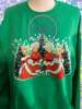 White Christmas scene sublimated on white glitter vinyl on an Irish Green sweetshirt.